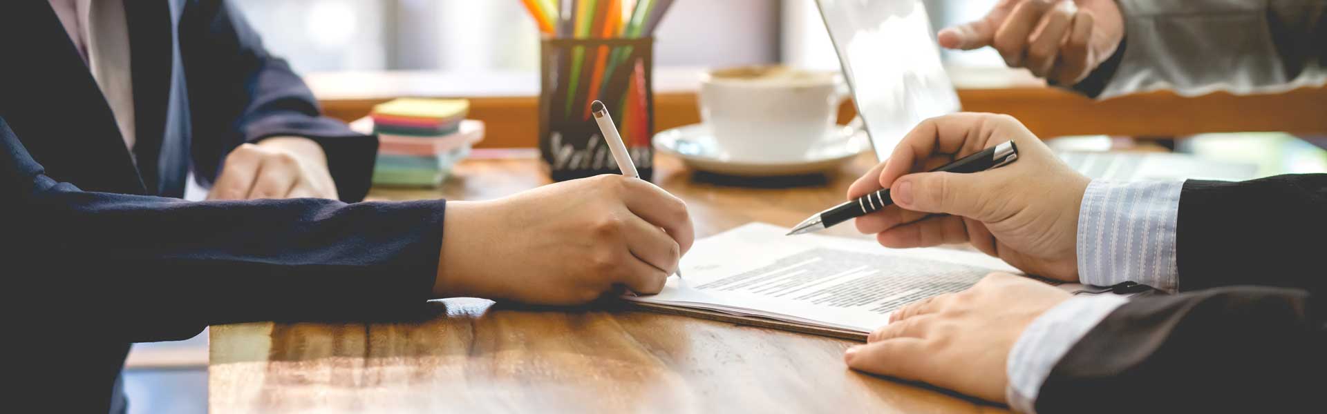 People signing equipment loan.