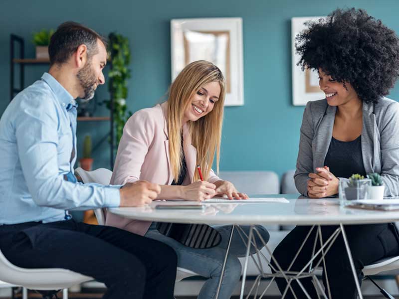 Girl signing loan papers