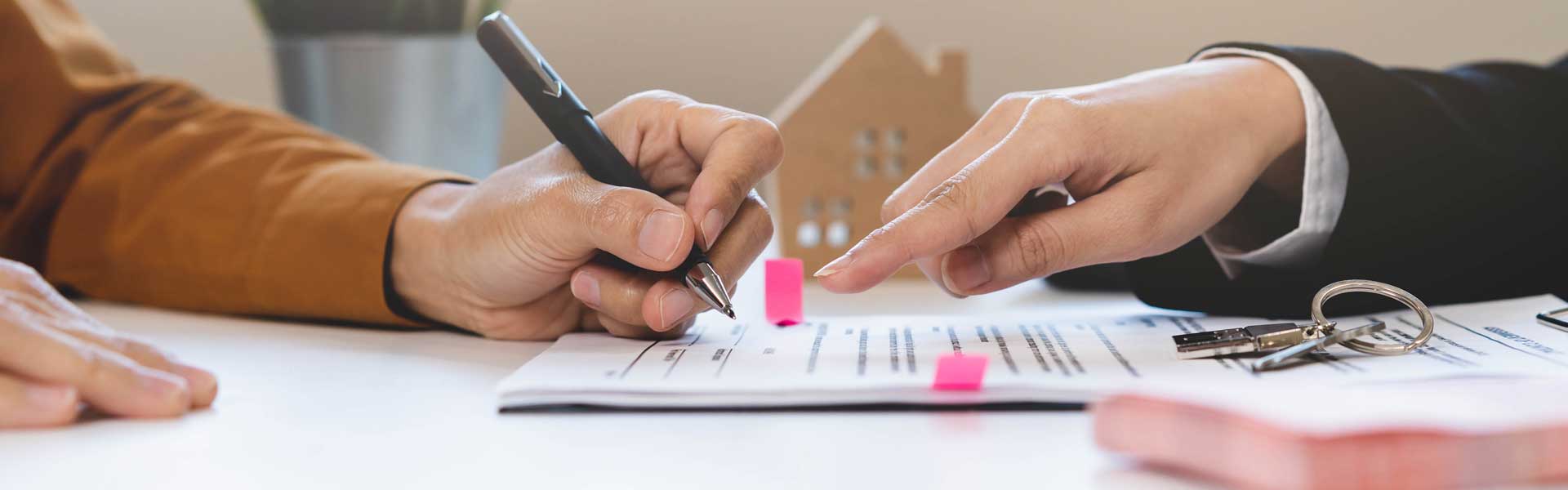 Man signing smsf finance papers.